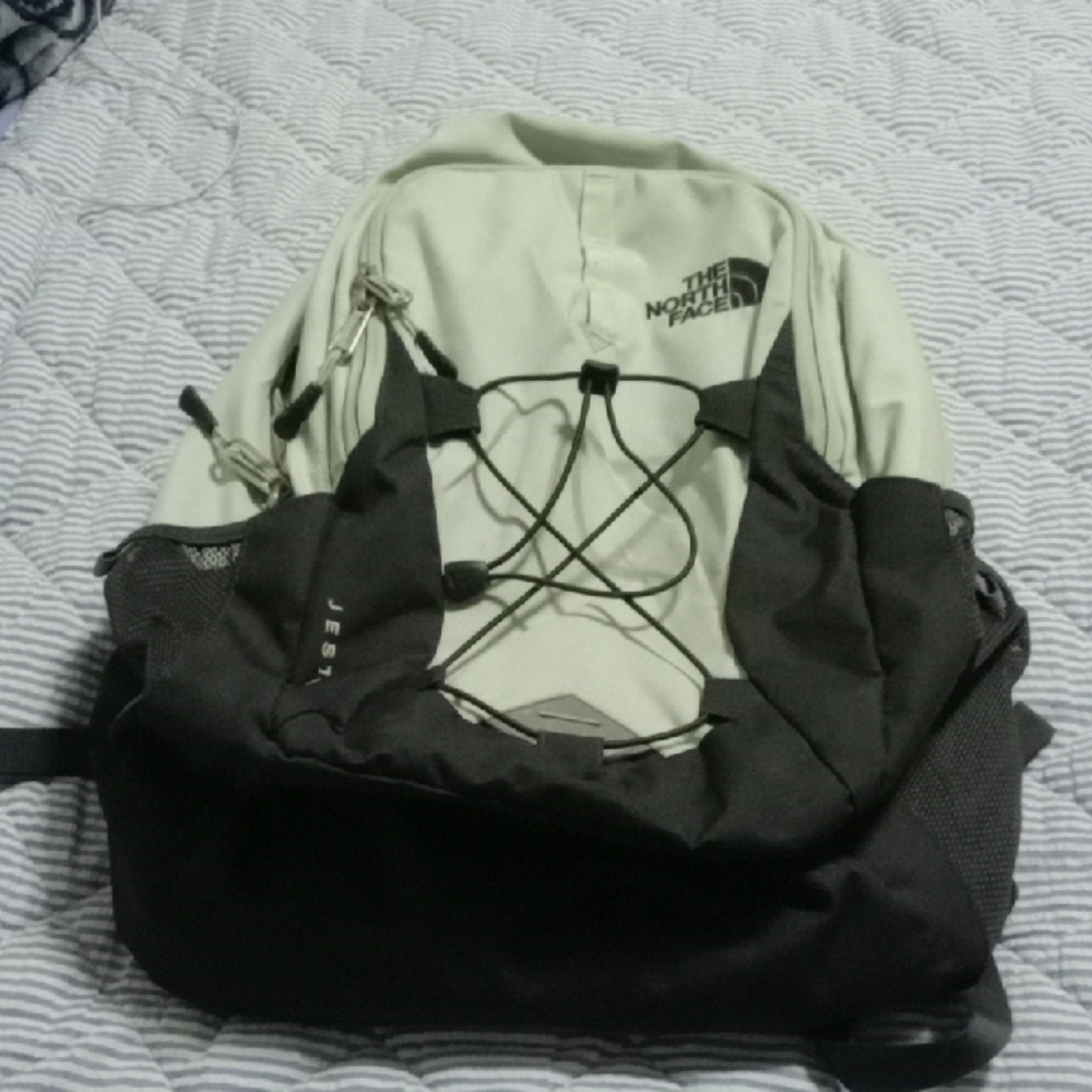 The North Face Cream and Black Backpack